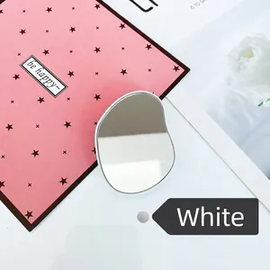 Close-up of a white pebble-shaped portable crystal hair remover with a mirror finish