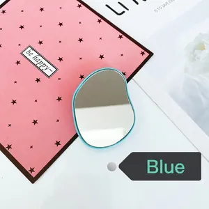 Blue folding telescopic air cushion mirror stand on a playful pink polka dot background