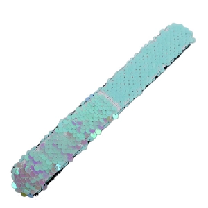 Detail of shimmering light blue iridescent sequins on the mermaid tail backpack material