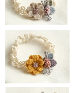 Detail of handmade floral lace headband with soft felt flowers for infants and toddlers