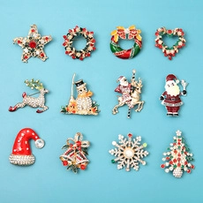 Set of 12 Christmas enamel brooches featuring Santa, reindeer and snowman designs
