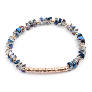 Detail of blue gradient crystal beads with gold metal spacers and hammered tube