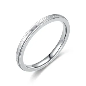 Minimalist silver titanium steel ring with sparkling pavé set crystals on the band