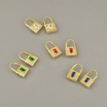 Macro view of four-color lock-shaped earrings with micro-pave zircons and gold plating
