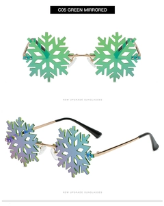 Close-up of green mirrored snowflake sunglasses with gold metal frame and rimless design