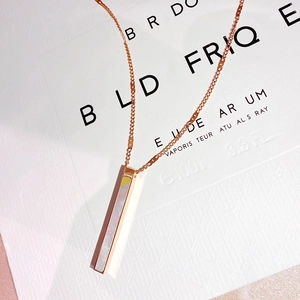 Minimalist rose gold titanium steel necklace with a shimmering iridescent shell pendant