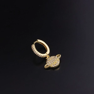 Fashionable gold planet hoop earring with sparkling zircon stones on dark background