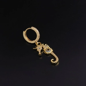 Gold seahorse hoop earring with sparkling cubic zirconia and blue gemstone eye details