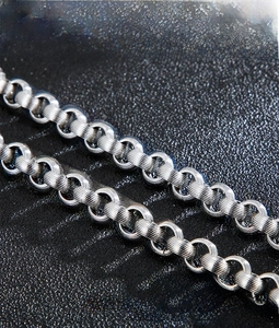 Detailed close-up of 316L stainless steel textured link chain with industrial finish