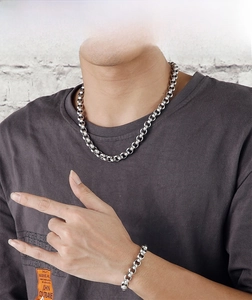 Close-up of industrial style 9mm titanium steel thick chain necklace and bracelet set