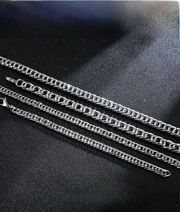 Detailed macro view of 316L stainless steel punk style chain links in silver finish