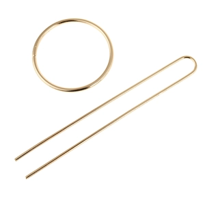 Detail view of metallic gold hair clip set featuring circular ring and U-shaped hair pin