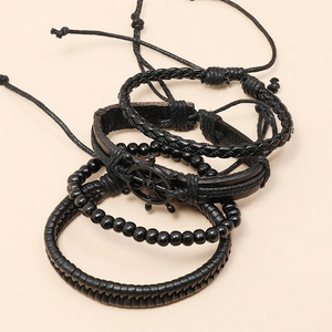Set of 4 vintage black leather bracelets featuring a metal rudder charm and woven beads