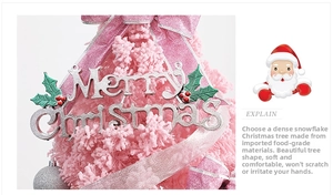 Detail of pink flocked Christmas tree featuring silver ornaments and silk ribbon bows