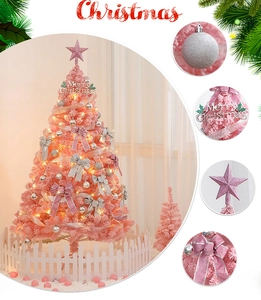 Pink artificial Christmas tree with ornaments, LED lights, and white picket fence base