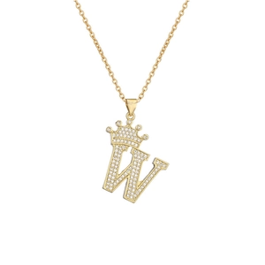 Macro shot of gold plated 'W' initial pendant necklace with crown and micro zircons