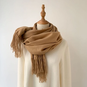 Camel cashmere-feel scarf with fringe tassels on a mannequin, warm winter shawl wrap