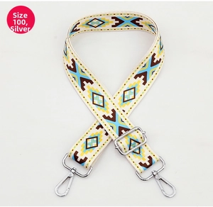 Detail of bohemian geometric pattern bag strap with silver metal lobster clasps