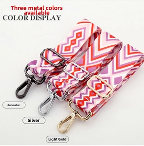 Adjustable colorful ethnic bag straps featuring geometric waves and gold metal hardware