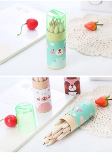 Close-up of 12-color pencils set in cartoon animal tube with built-in green sharpener