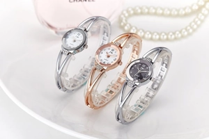 Three elegant ladies quartz watches with rhinestone bangles and metal镂空 bands