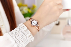 Elegant rose gold bracelet watch for women with rhinestone inlay and white round dial