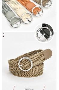 Close-up of woven elastic belts with silver round buckles in multiple colors for women