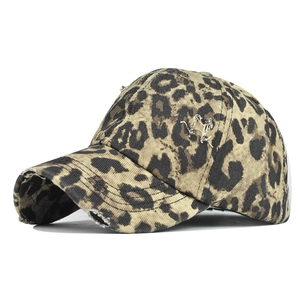 Detail of leopard print baseball cap with vintage distressed edges and worn-out brim