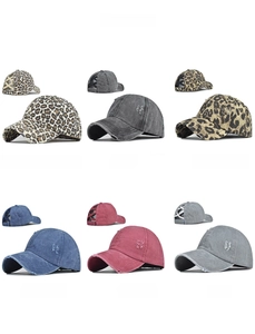 Detail view of multi-color washed baseball caps with elastic criss-cross ponytail design