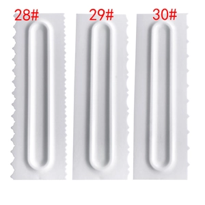 3-piece set of white plastic cake scrapers with different serrated edge patterns for baking