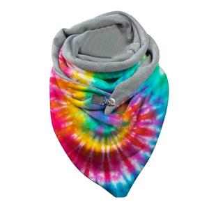 Detail of winter scarf with rainbow tie-dye pattern and soft grey plush lining and buttons