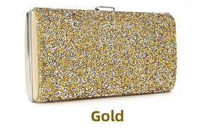 Close-up of champagne gold evening clutch with sparkling rhinestones and metal closure
