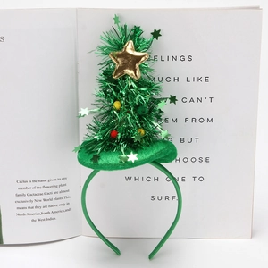 Green velvet Christmas tree headband with golden sequins and stars on a white background