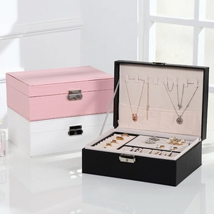 Multi-tier mini jewelry box featuring velvet lining, ring slots and necklace hooks in pink