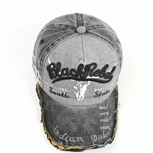 Detailed view of washed vintage baseball cap with Black Rebel embroidery and frayed edges