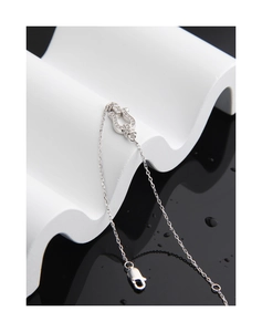 Detailed view of S925 sterling silver horseshoe pendant with sparkling pavé cubic zirconia