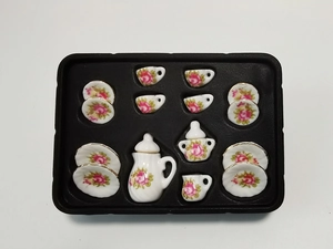 Detail view of 15-piece dollhouse miniature ceramic tea set with pink rose pattern