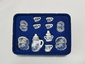 Detailed top view of 15pcs miniature ceramic dollhouse tea set with blue floral patterns