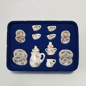 Miniature white ceramic dollhouse tea set with red cherry patterns and gold trim in 15 pieces