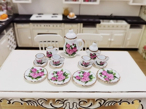 Miniature dollhouse ceramic tea set with pink rose patterns and gold trim detail