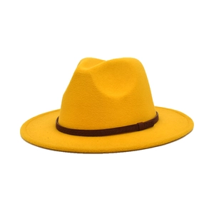 Close-up of bright yellow wool fedora hat with deep brown textured decorative band