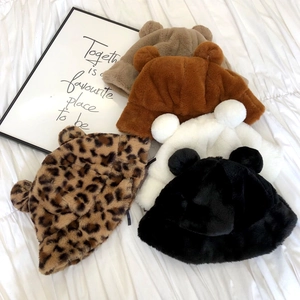 Plush bear ear bucket hats in leopard print and solid colors on a white background