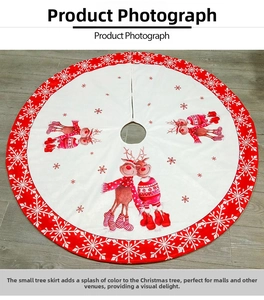 Detail of 122cm Christmas tree skirt featuring printed snowflake and reindeer pattern