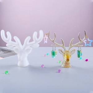 DIY silicone mold for reindeer antler jewelry stand with resin craft finish details