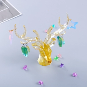 Detail of glitter resin deer antler stand for jewelry storage and earring display