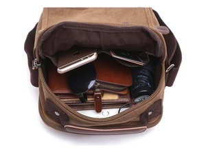 Top view of khaki canvas crossbody bag showing large capacity for tablet and umbrella
