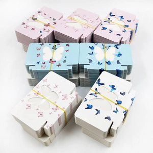Flat pack rectangular eyelash boxes with butterfly window in pink, blue, and white colors
