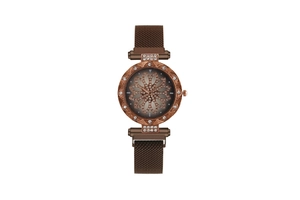 Detail of flower dial with rhinestones and magnetic mesh band on luxury ladies watch