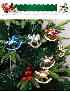 Macro view of metallic rocking horse ornaments hanging on a Christmas tree branch