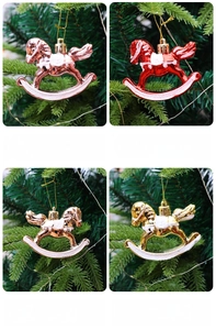 Set of four shiny plated rocking horse Christmas ornaments in gold and red colors